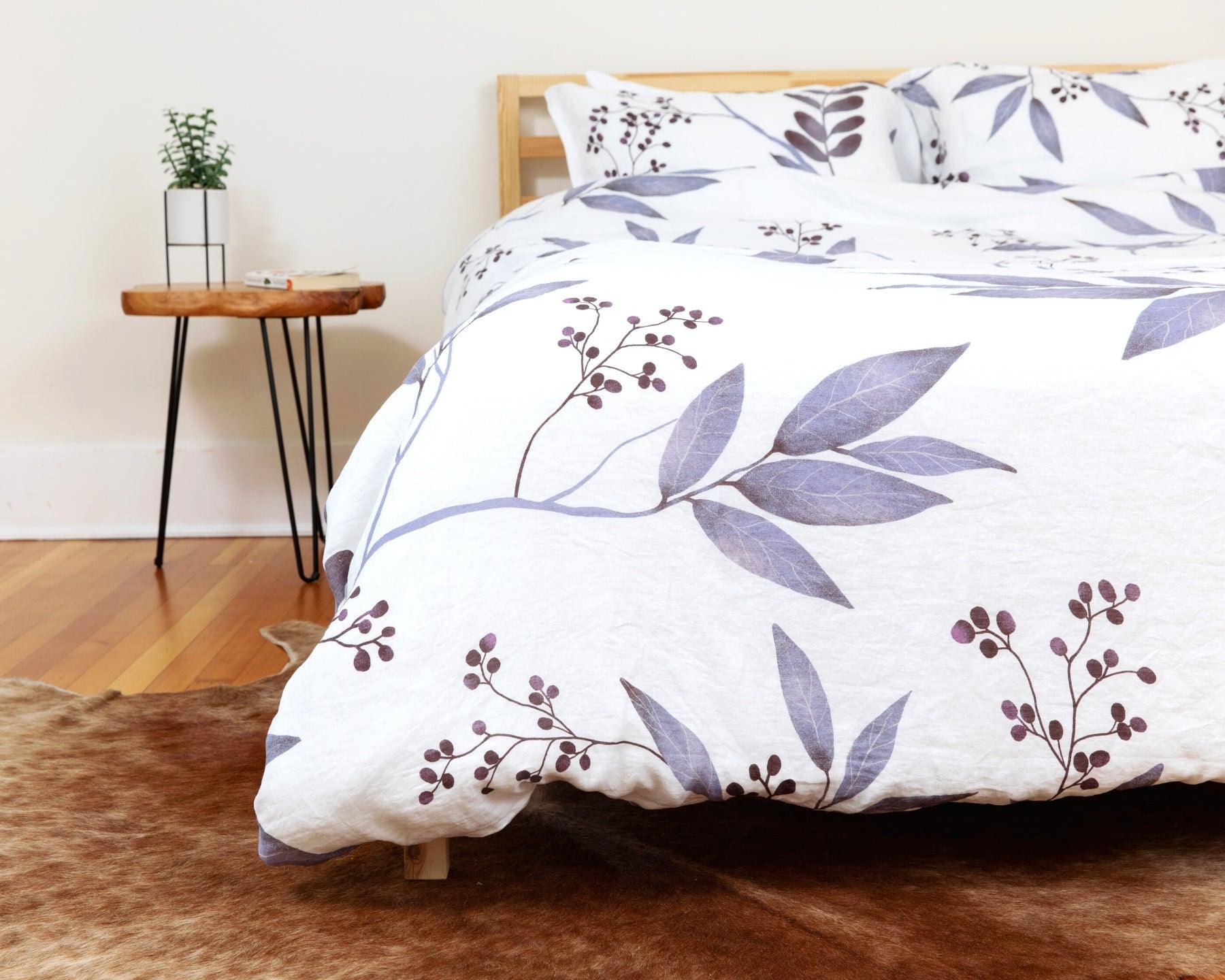 European organic linen duvet cover set in moderns Scandinavian design on white with purple leaves