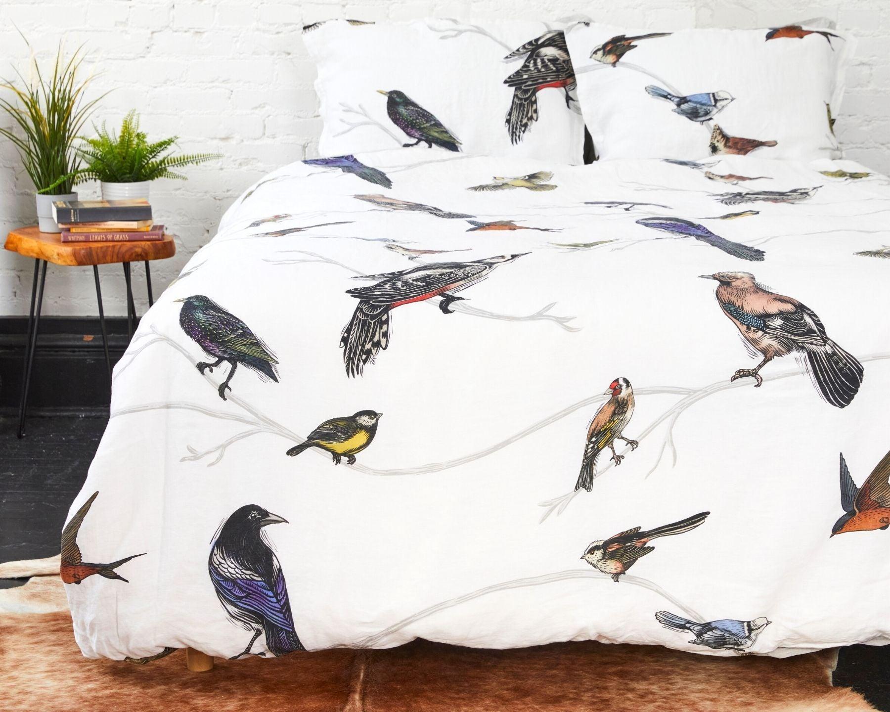 Organic european linen duvet cover set with Scandinavian birds design and chambray grey backside
